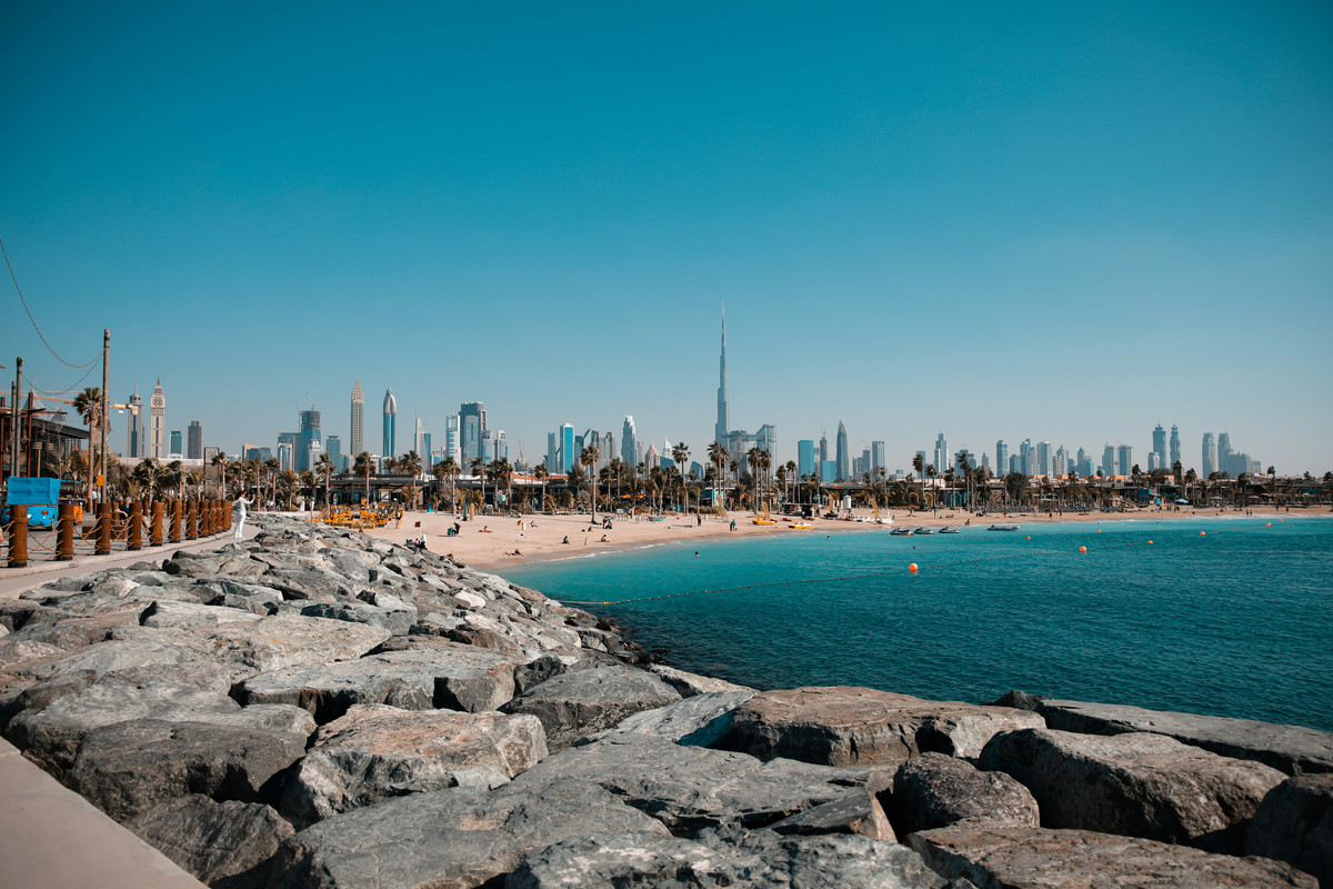 An image of Dubai beach with the skyline in the background