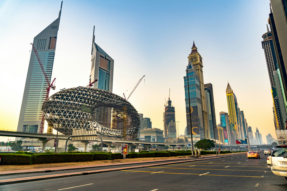 Emirates Towers and Museum of the Future and Dubai skyline at sunset